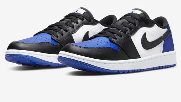 Black, blue, and white Jordan golf shoes.